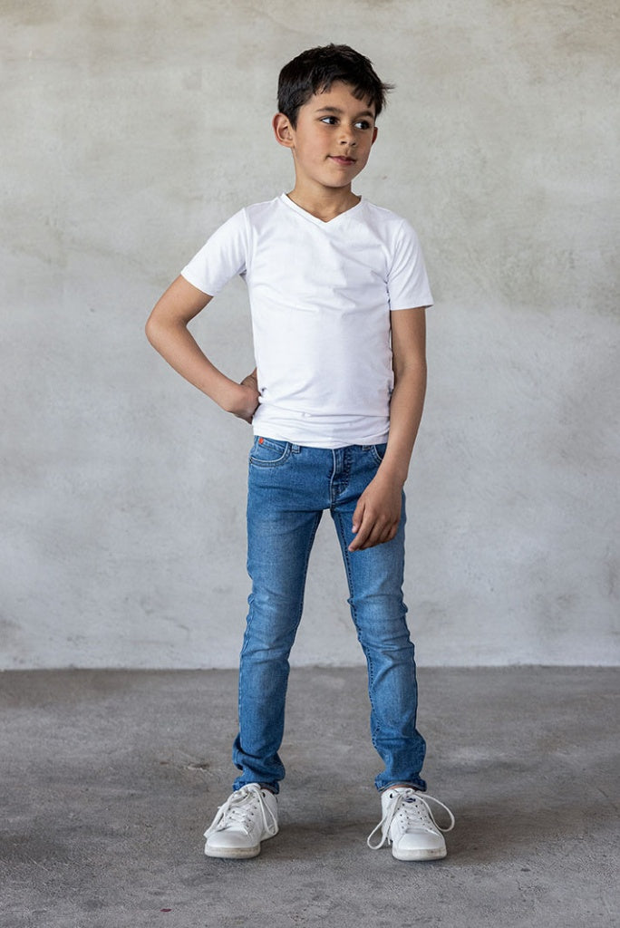 Boy wearing skinny jeans in light used | Front View