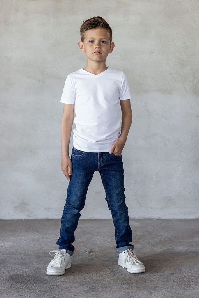 Front view of the boy wearing the skinny jeans in dark used wash by TYGO & vito