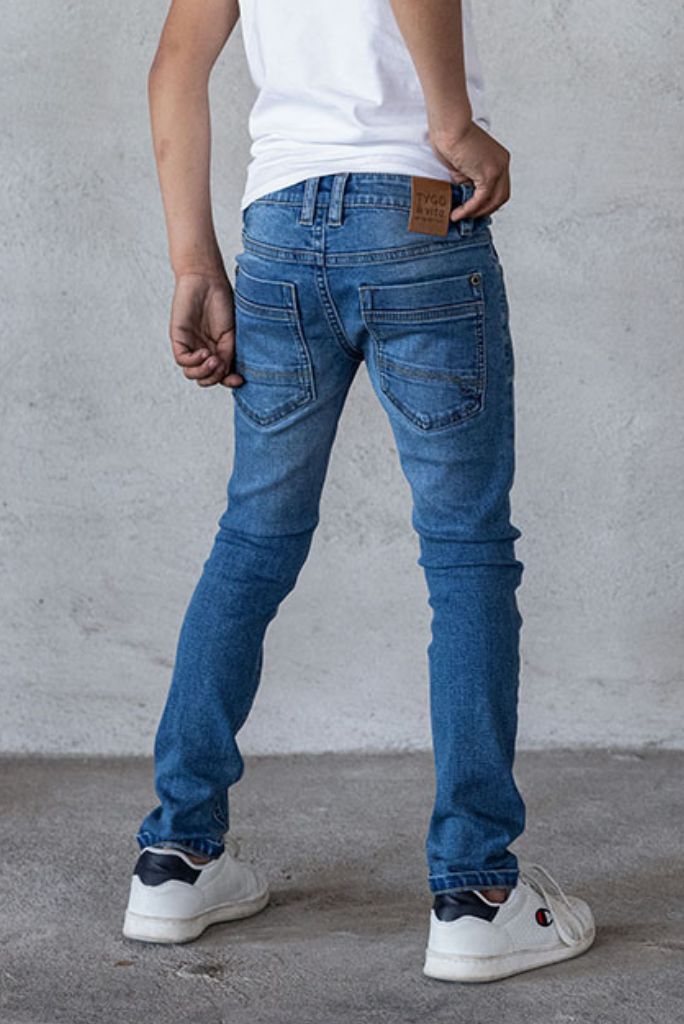 Boy wearing the skinny jeans in light wash | Close Back View