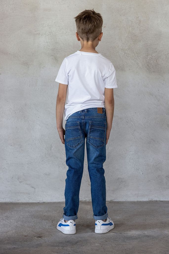 Boy wearing the skinny jeans in medium used wash by TYGO & vito | Back View