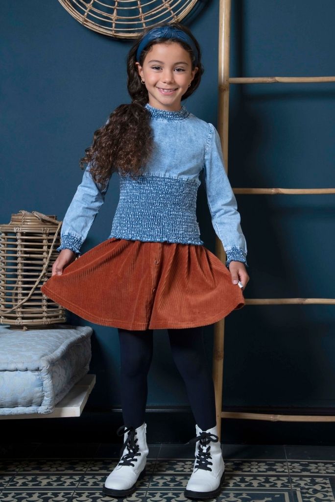 Girl smiling and posing with the brown cord skirt by B.Nosy