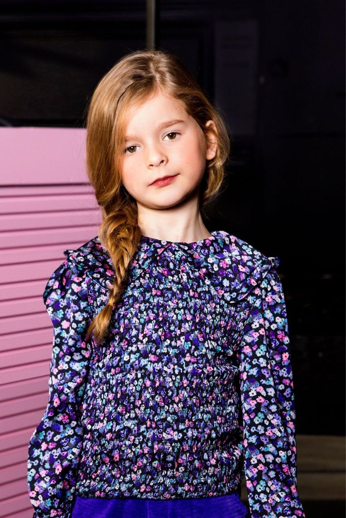 Girl wearing the floral blouse