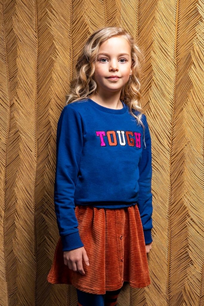 Girl wearing the blue embroidered sweat by B.Nosy