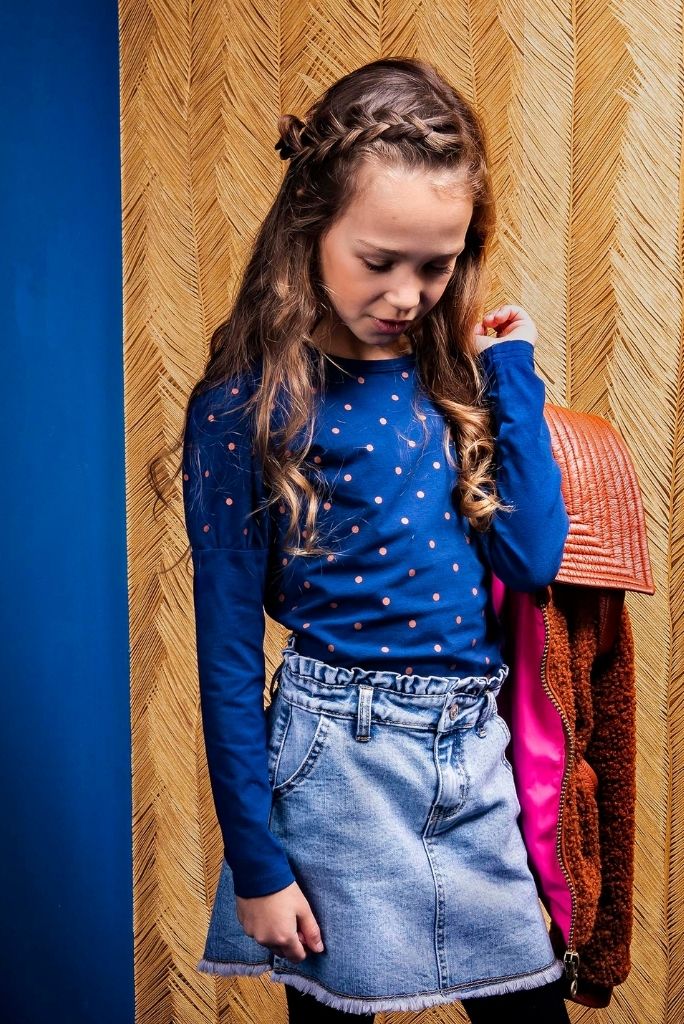 Girls looking down wearing the navy blue long sleeve top with polka dots by B.Nosy
