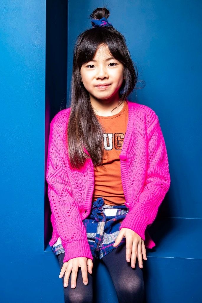 Girl wearing the brown long sleeve top by B.Nosy