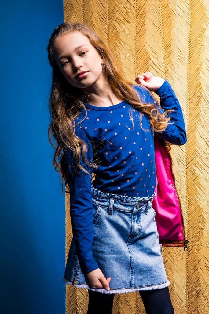 Girl wearing the navy polka dot top by B.Nosy