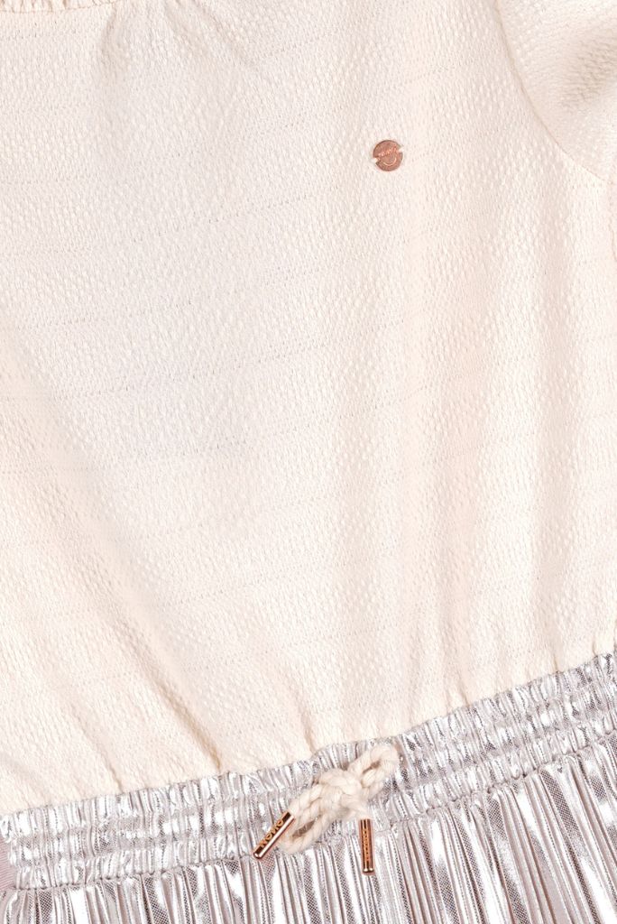 Close-up of a textured fabric with a metallic trim