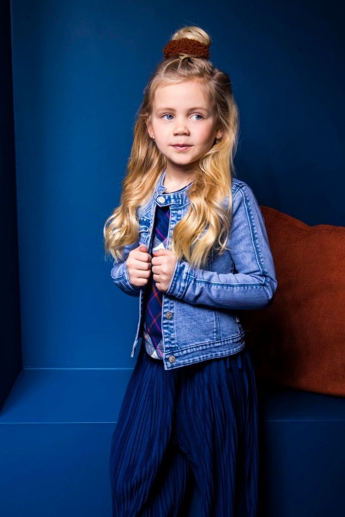 A little girls wearing the light blue B.Nosy denim jacket