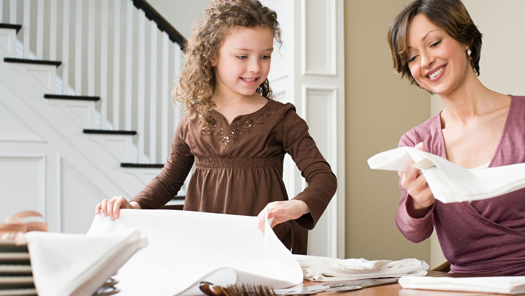 Mother folding sustainable kidswear made from soft cotton