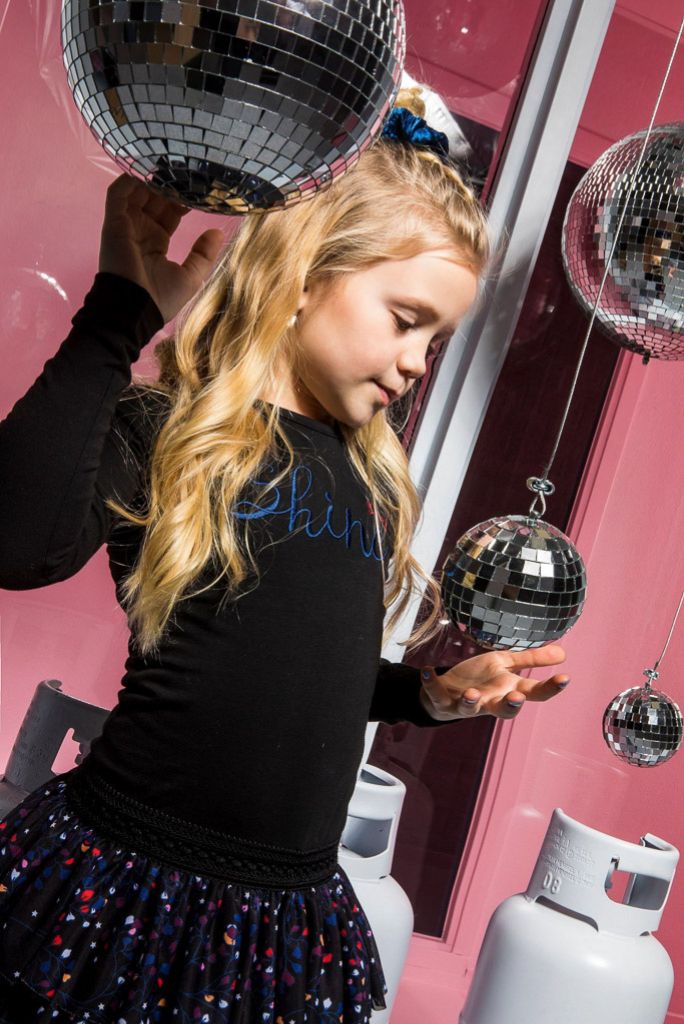 Girl wearing the long sleeve black tutu dress by B.Nosy