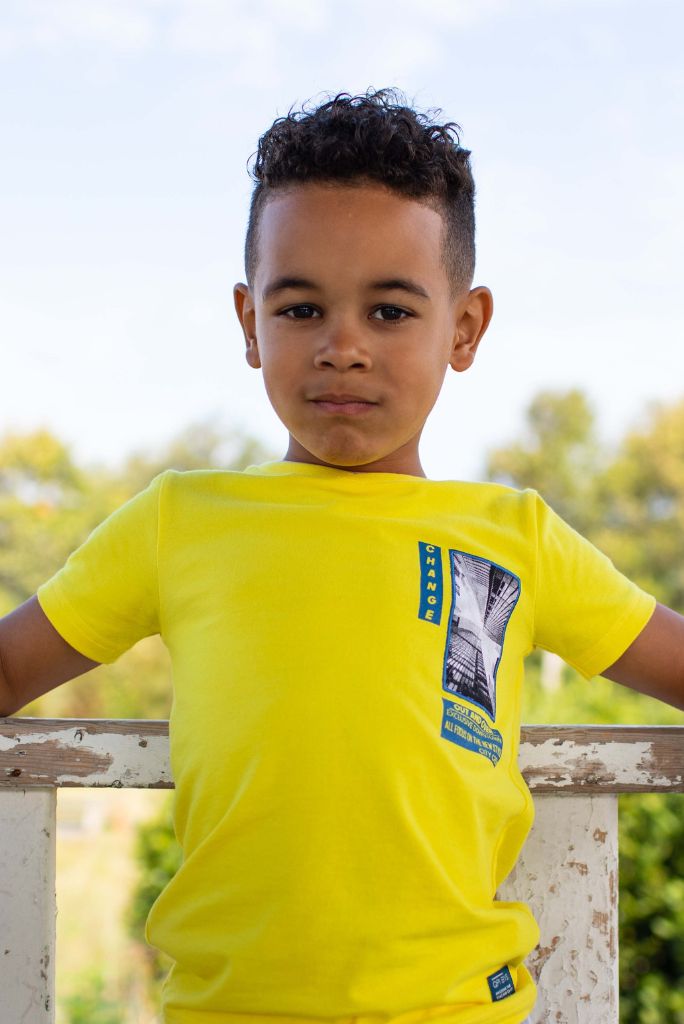 Close view of the boy wearing the yellow tee Ferhan by Quapi