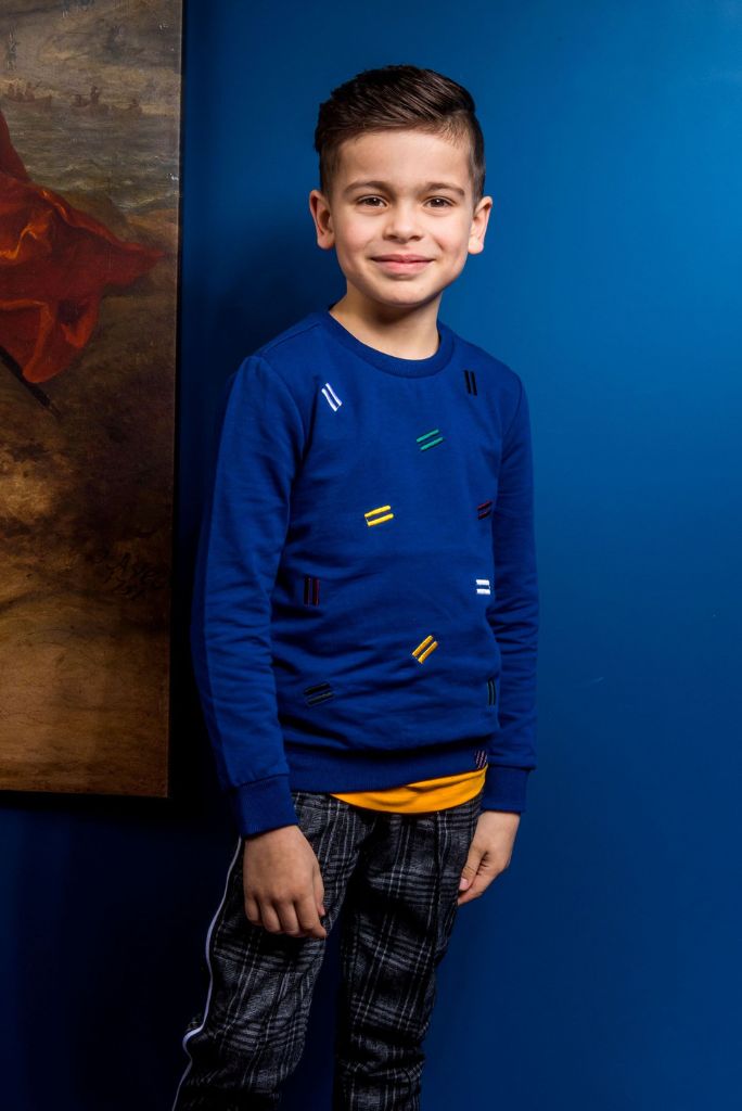 Boy wearing the blue jumper by B.Nosy with check pants