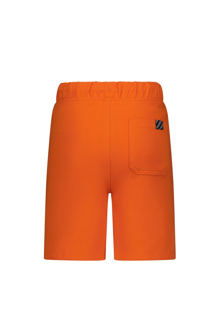 Orange shorts with a logo on a white background