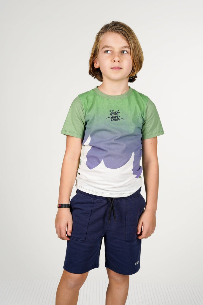 Child wearing navy blue shorts Pax by B.Nosy, standing against a plain background