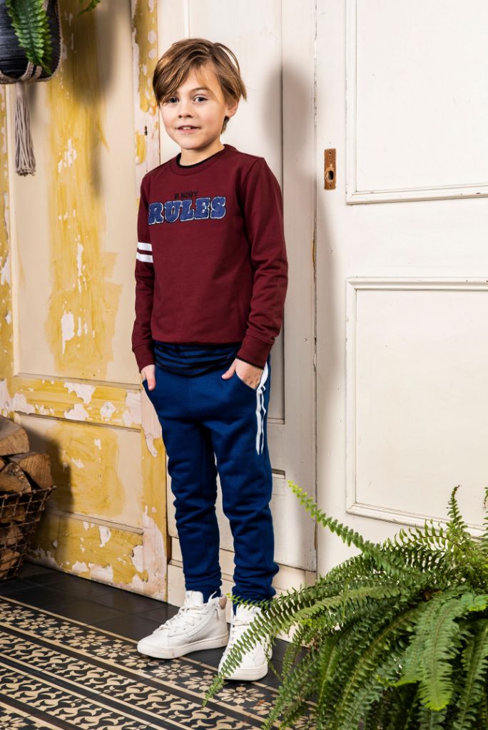 Boy wearing the navy trackpants by B.Nosy