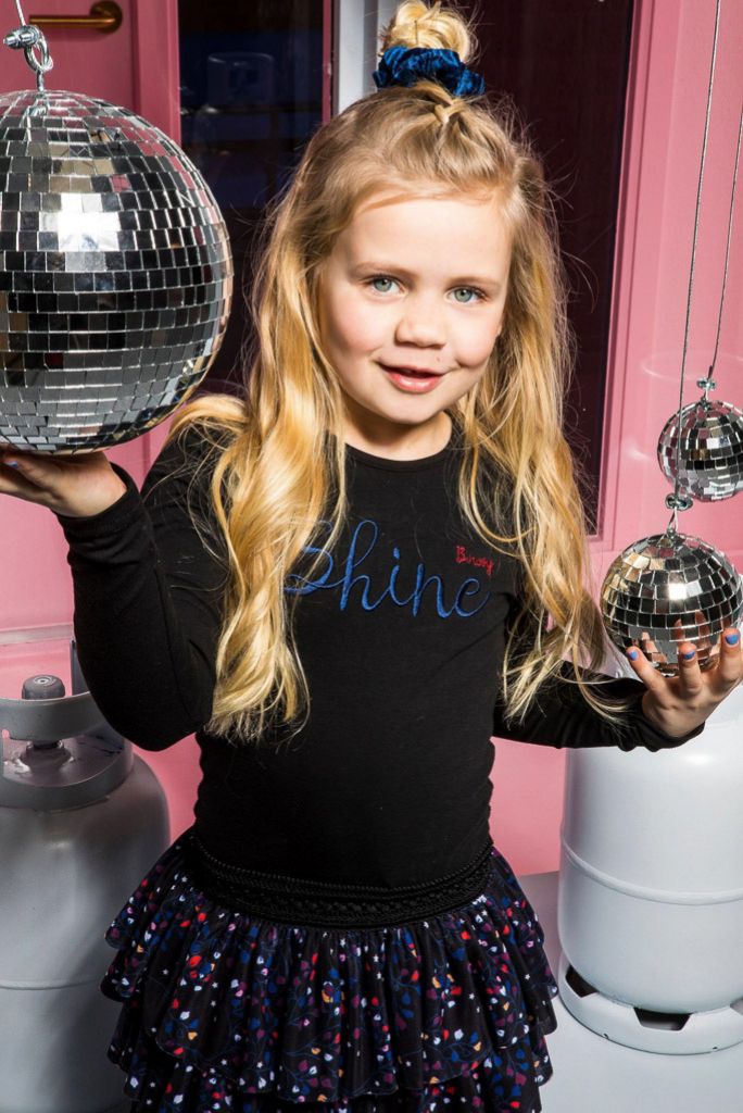 Girl wearing the black tutu party dress