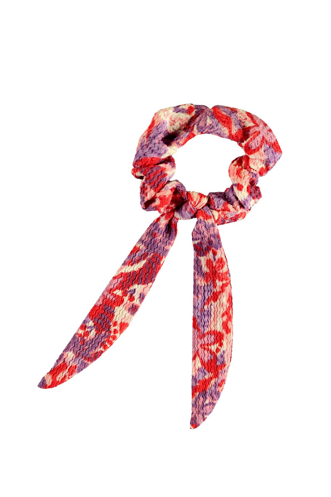 A red and pink girls' floral printed scrunchie with a ribbon-like tail
