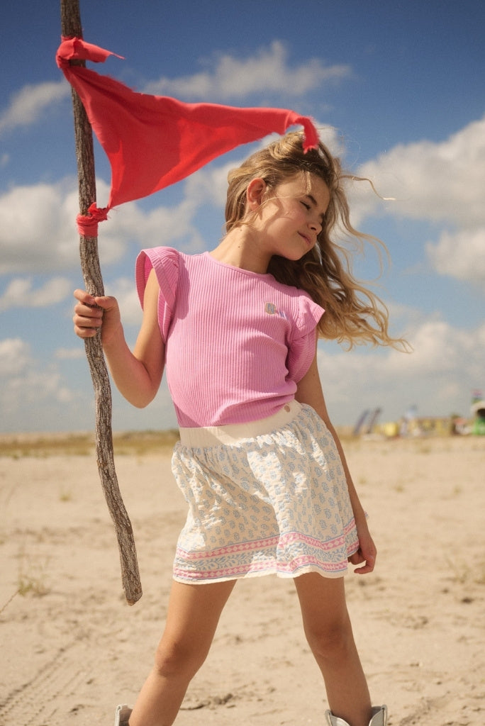 Girl looking to the side and wearing the purple top Kesta by NONO