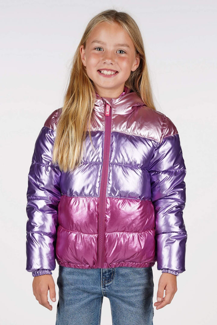 Young girl wearing a metallic purple and pink puffer jacket on a white background