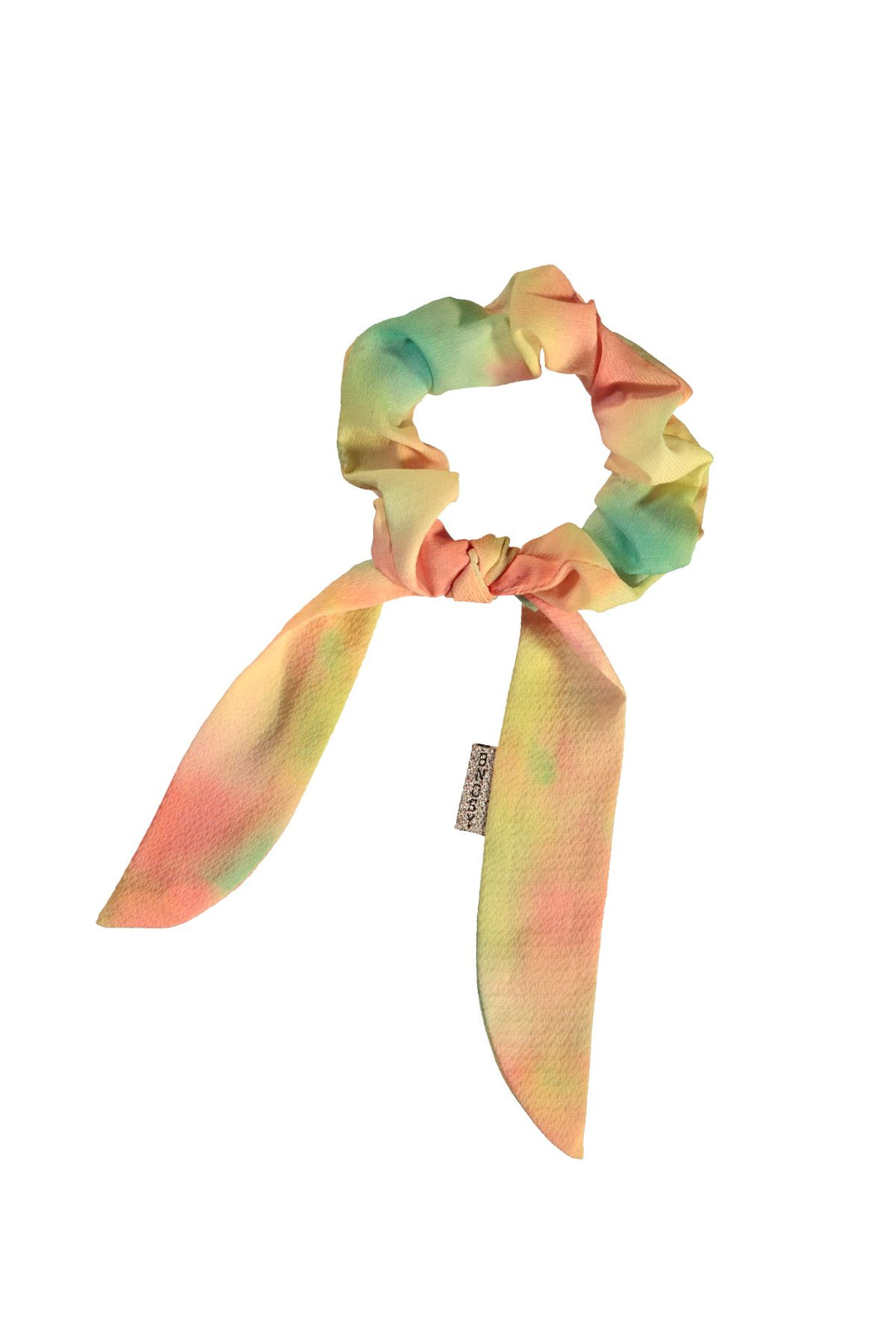 A pastel tie-dye scrunchie with long ribbon tails, featuring a soft blend of pink, yellow, and mint green.