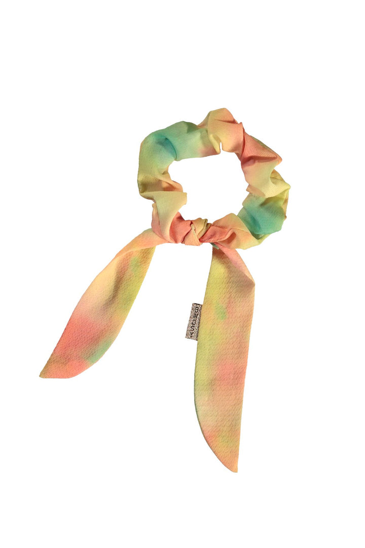 A pastel tie-dye scrunchie with long ribbon tails, featuring a soft blend of pink, yellow, and mint green.
