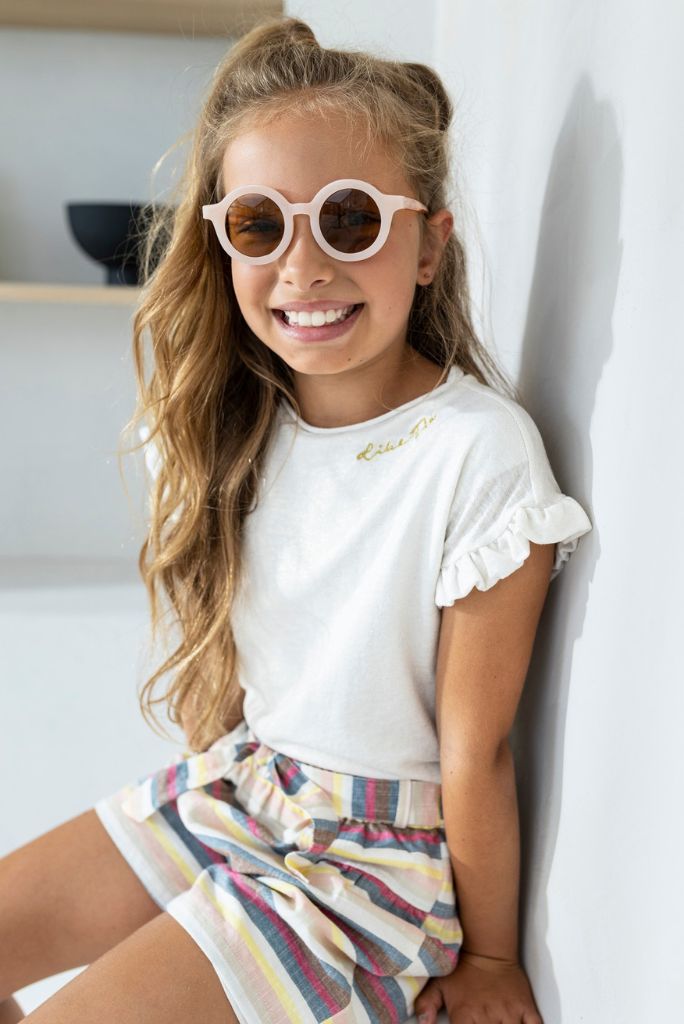 Girl wearing the white T-Shirt by Like FLO and smiling