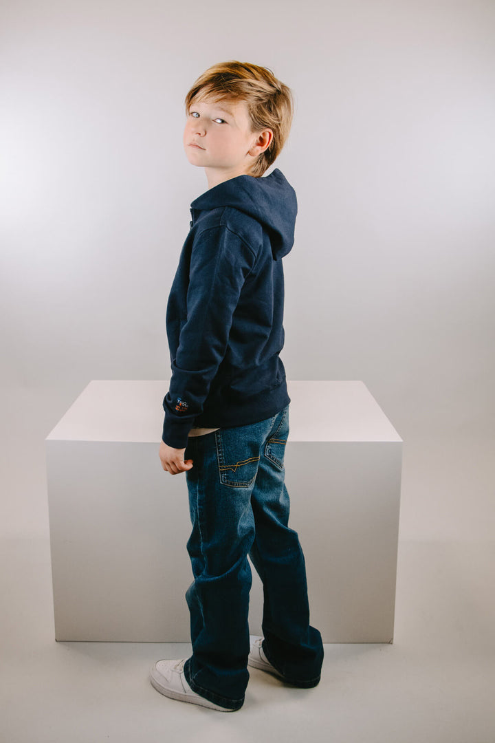 A boy wearing the jeans Bozz