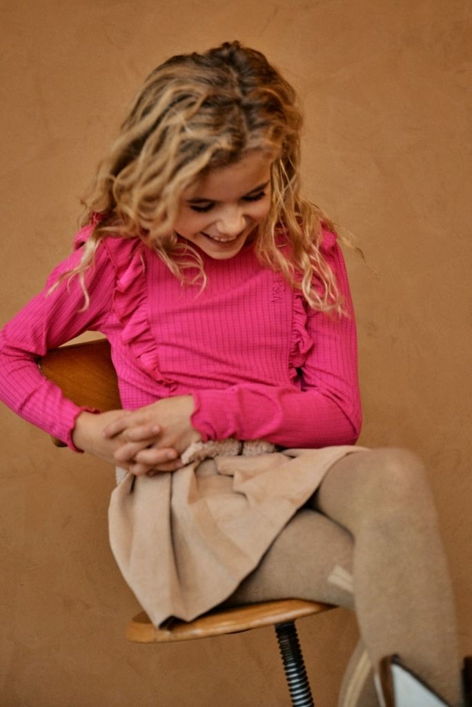 Smiling girl wearing the pink top Klari