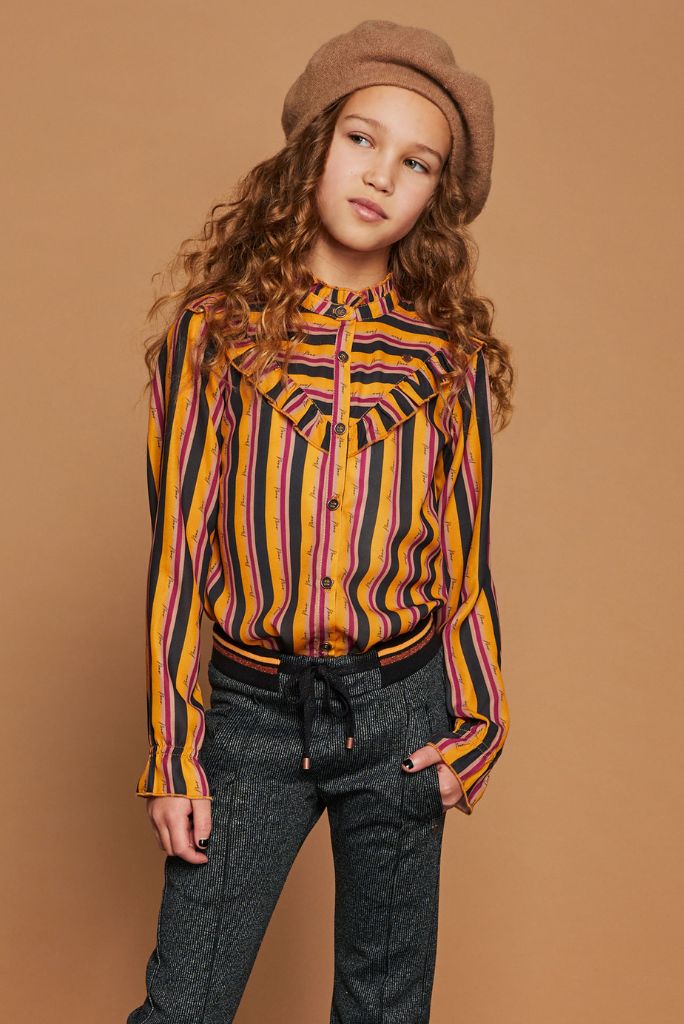 A girl wearing the Tikky stripe blouse by NoNo